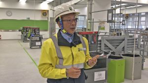 The Supervising Instructor, Mr. SIU Yeung-Chiu, introduces to us the facilities in the metal scaffolder testing workshop and the skill requirements for the related trade.