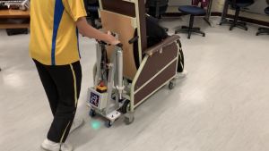 Considerable weight will be added to a Geri chair when an elderly person sits on it, making it difficult for a carer to move it. The students have invented an electric mini pallet truck that can help reduce their burden in moving around the Geri chairs.