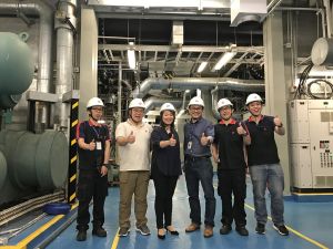 Janet (third left) is pictured with her team at the centralised air-conditioning plant room of the Central Government Offices at Tamar.