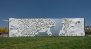 The Artistic Feature Wall features a vertical map revealing the unique urban fabric along the transect of the Victoria Harbour with iconic buildings highlighted. The lighting effect of the wall offers visitors an aerial view of Hong Kong’s dazzling night scene, as opposed to its equally unique day view.