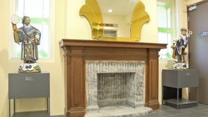 One of the suites has become a lift lobby in the mansion with its fireplace and wooden decorations retained.