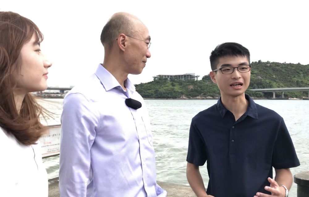 Mr Karl CHAN (right) has been deployed to a construction site at Tai O for his internship. His duty is to assist resident site staff to manage the site and implement local improvement works.
