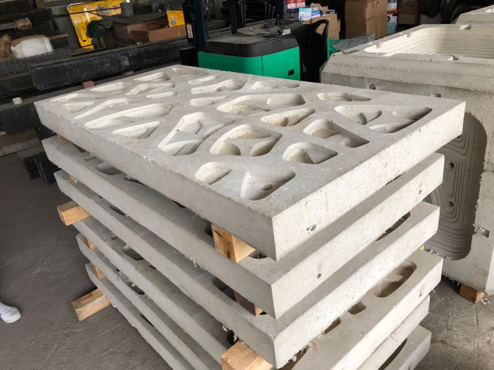 Pictured are enhanced seawall panels. Their uneven and rather rough surfaces can retain seawater and provide shade, facilitating the growth of microbial film and algae.