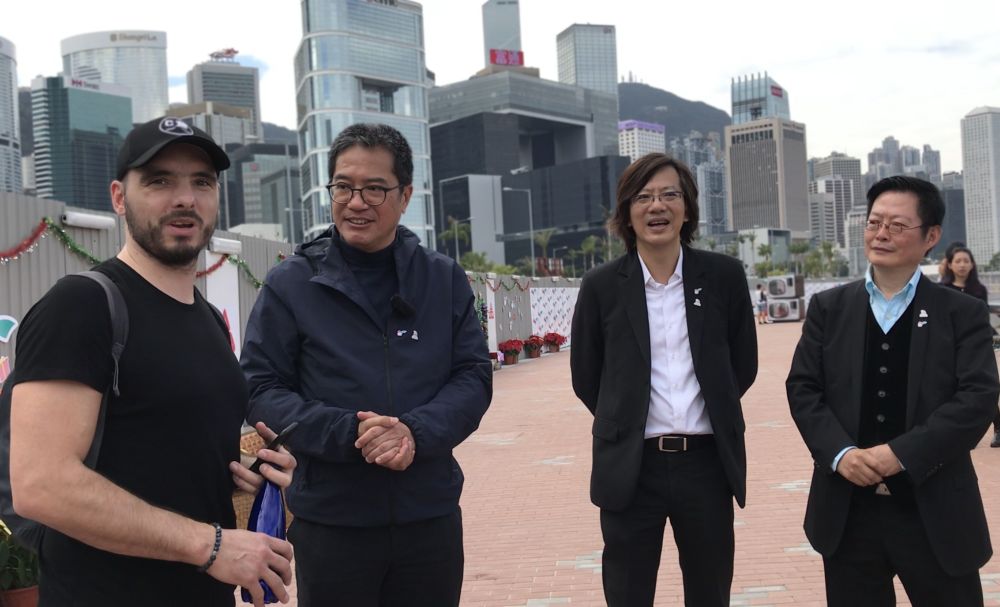 Michal, a tourist from the Czech Republic (first left), says the promenade is a cozy and peaceful place amid the busy town centre of Hong Kong.