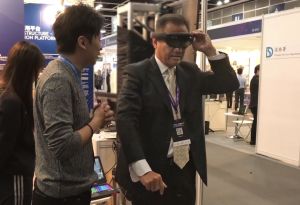 The Director of Planning, Mr Raymond LEE, demonstrates how to use the Hololens with Mixed Reality technology to experience the functions of the 3D Planning and Design System.
