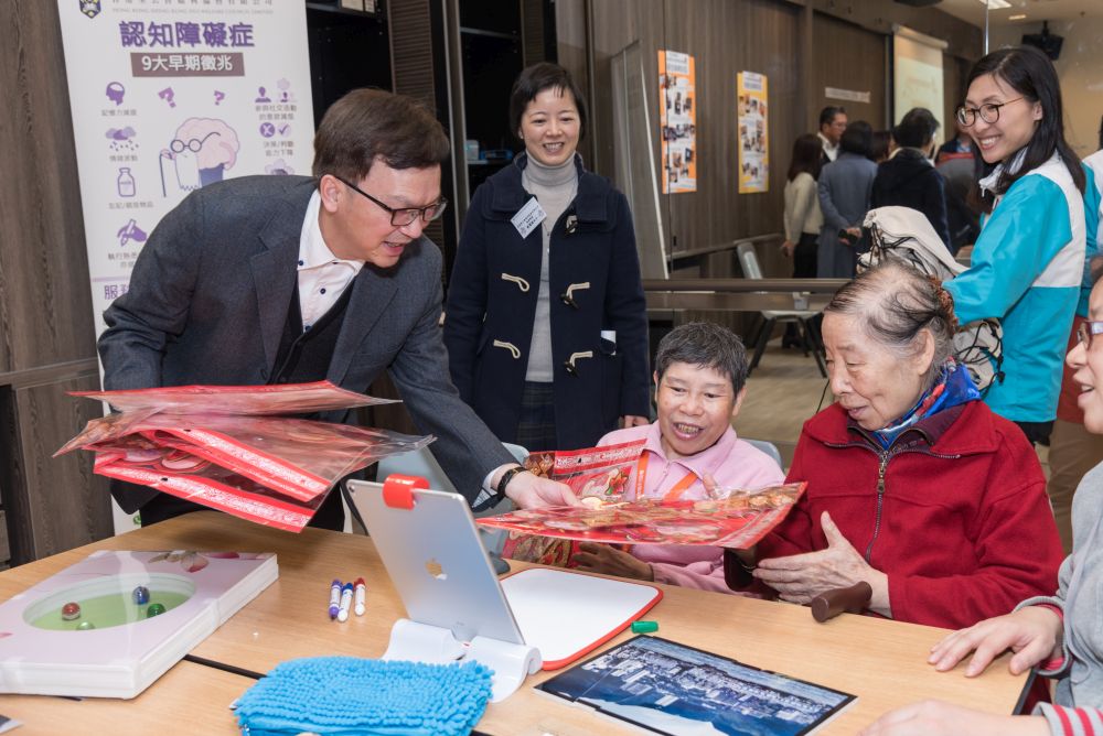 Distributing spring couplets of the Year of the Rat to the elders.