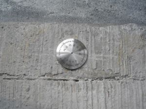 A horizontal control point with the inscription “the Survey and Mapping Office”. It provides horizontal position reference for the purpose of survey.