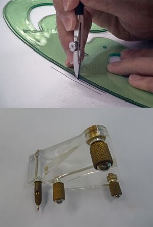 Various drawing tools used by cartographers in the past, including a plier-like ruling pen for drawing lines and a swivel cutter for parallel curves.