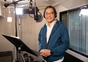 The construction sector joins hands with the Construction Industry Council (CIC), the Development Bureau (DEVB), the CEDD, as well as ten professional bodies and trade associations to record the song Sail through the Pandemic together. Frontline practitioners and workers are also invited to participate in the shooting the MV. Pictured is the Secretary for Development (SDEV), Mr WONG Wai-lun, Michael, recording Sail through the Pandemic at the studio.