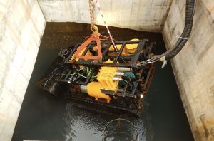 The robot will be lifted up with a crane and sent into the box culvert concerned through its opening. The operator can then remotely operate the robot for desilting from his workstation.