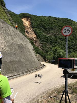 The Landslip Investigation Section uses drones to observe and take photos of the slope and puts together a 3D digital terrain model with the related data to help them to find out the causes and mechanism of the landslide above Sai Wan Road in Sai Kung.