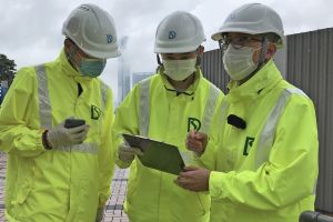 Besides handling his daily work, Mr CHUI Wai-yiu (right) has to be on call at any time to deal with emergency cases, including assisting in the emergency clearance of blocked drains and watercourses.