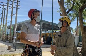 President of the Tree Climbing Hong Kong, Mr LI Kwok-man (right), reminds his student Mr LEUNG Yat-fat (left) that safety is top priority in arboriculture work and checking is a must before using tools.