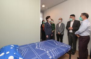 The Chief Executive, Mrs LAM CHENG Yuet-ngor, Carrie (first left, front row) inspected the quarantine camps at Penny’s Bay Phase 2 earlier (29 September). In the picture, Mrs Carrie LAM is touring one of the units of the quarantine centre.