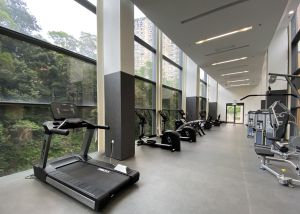 Quite a lot of floor-to-ceiling glass panels are used in the sports centre to let in natural light and to allow visitors to enjoy the green surroundings while doing exercise.