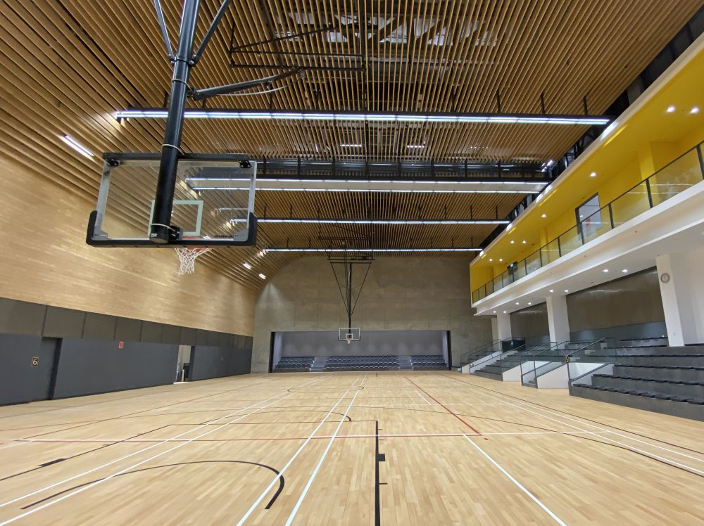 Different finishes materials are used in outdoor and indoor areas to give people distinctly different feelings. Fair-faced concrete is mostly applied to the façades to give a natural and raw feeling. Wooden and warm-coloured materials are used mainly on the walls and floors of the arena to create a relatively warm environment.