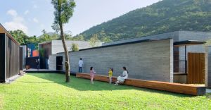On the left of the picture is the multi-purpose room, while the caretakers’ office and reception area are on the right. The lawn between the two buildings is preserved for outdoor activities.