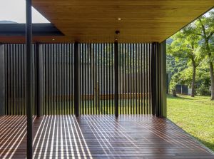 The team of architects uses wooden slats as screens to bring natural coolness to visitors.