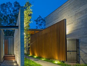 The team of architects uses wooden slats as screens to bring natural coolness to visitors.