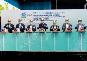 The SDEV, Mr Michael WONG (centre), the Permanent Secretary for Development (Works), Mr Lam Sai-hung (third right), the Director of Civil Engineering and Development, Mr LAU Chun-kit, Ricky (third left), Project Manager of the East Development Office (EDO) of the Civil Engineering and Development Department (CEDD), Mr LEUNG Chung-lap, Michael (first left), and representatives of the project consultant and contractor attend the breakthrough ceremony, marking a new milestone in tunnel construction.