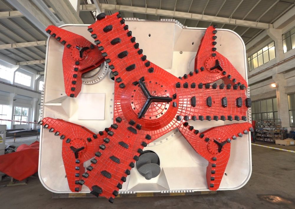 The pictured cutter head of the RTBM, weighing about 90 tonnes, is made up of a main cutter disk and four auxiliary cutter disks.