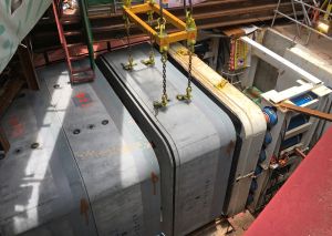 After installing the hydraulic jacks, the cradle and the RTBM in the launching shaft, the workers put inside the prefabricated tunnel segments one by one. The boring machine and the hydraulic jacks then push the whole series of segments forward gradually until reaching the receiving shaft at the other end of the tunnel.