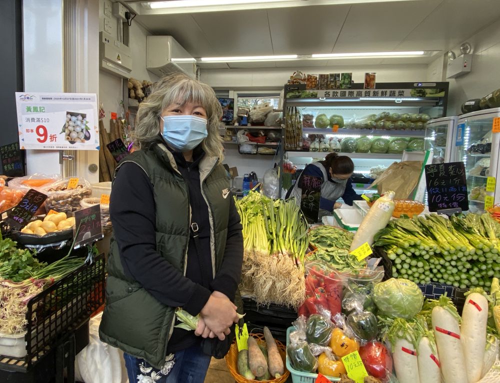 Miss LAM, a vegetable vendor of the market, says that the comfortable environment of the market has attracted many local residents to visit it.