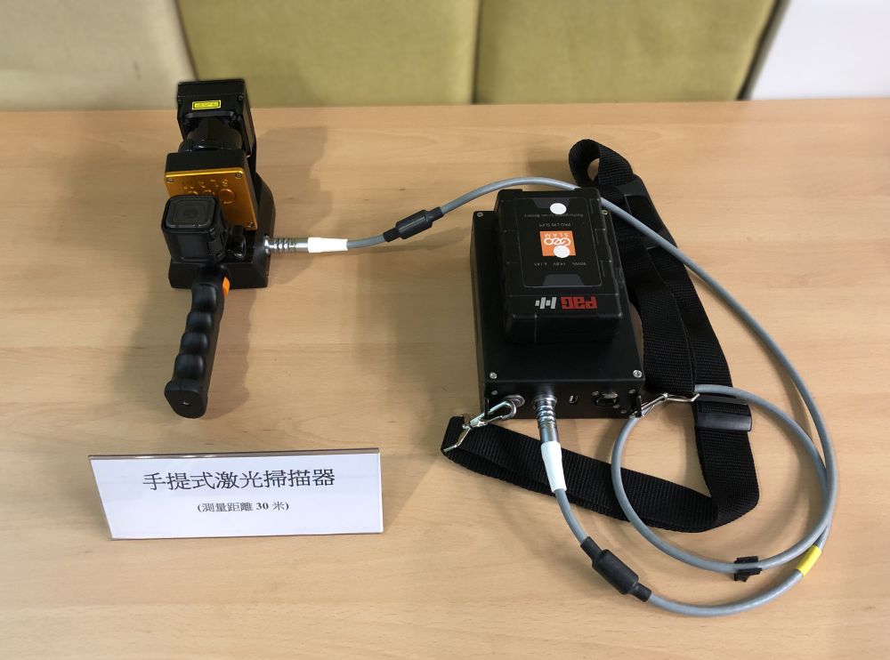 Pictured is a handheld laser scanner.