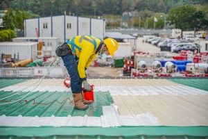 The InnoTCE is also an “incubation platform for technologies”. Pictured is a worker using the InnoTCE’s roof as the first field trial site for the Passive Radiative Cooling Coating. The coating can reduce a building’s surface temperature, thereby saving the energy needed for air-conditioning.