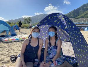 Ms TONG (right) and Ms CHAN (left), both Tai Po residents, say they are very pleased with the opening of Lung Mei Beach as they no longer need to travel a long distance to the beaches on Hong Kong Island.
