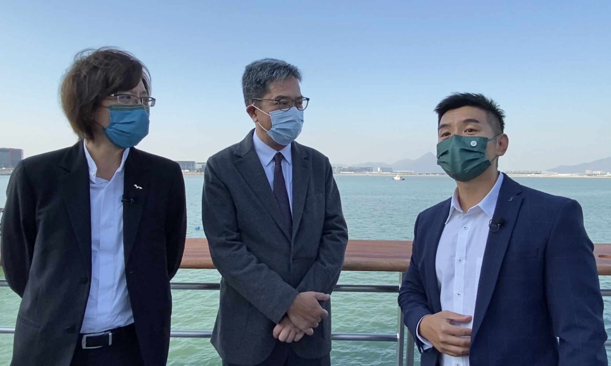 The SDEV, Mr Michael WONG (centre), is briefed by Senior Engineer of the SLO of the CEDD, Mr YUNG Sai-man, Gary (right), on the progress of the Tung Chung East Promenade improvement works.
