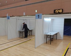 Picture shows an EMSD’s colleague carrying out addition works to the power supply and lighting systems.