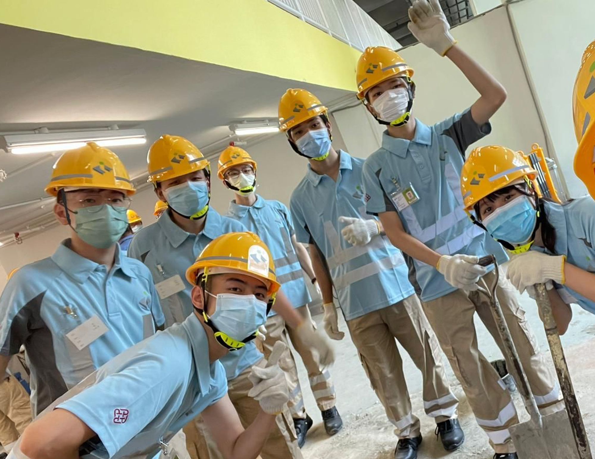 Mr John ZHANG (first left, front row) is now studying quantity surveying, hoping to become a professional in the subject and be promoted to positions such as project manager.