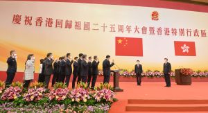 President Xi Jinping (first right) swore in Principal Officials of the sixth-term Government of the Hong Kong Special Administrative Region at the Inaugural Ceremony of the Sixth-term Government of the Hong Kong Special Administrative Region at the Hong Kong Convention and Exhibition Centre on 1 July 2022.  Looking on is the Chief Executive, Mr John LEE (second right).