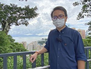 Mr Benjamin SIN is standing on the newly added access ramp to introduce the ramp, which can serve as a lookout point for visitors to enjoy the panoramic sea view of the Southern District.