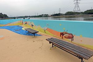 The maintenance access near the Yuen Long Bypass Floodway Engineered Wetland has been converted into a public space with murals, a pavilion, benches, etc. for public enjoyment.