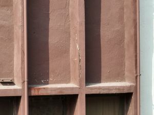 Pictured is the image of a building’s external walls taken by a drone.