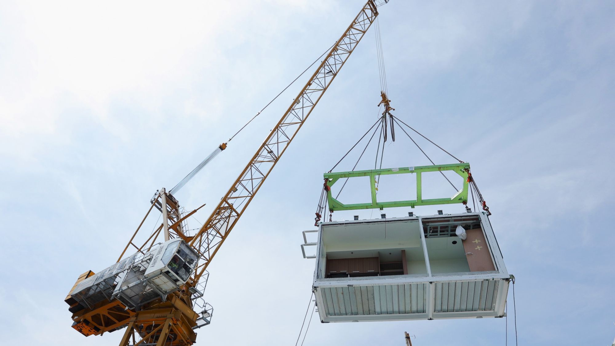 Hong Kong’s construction industry has embraced the innovative spirit of Lo Pan culture and  actively promoted high productivity construction in recent years. Modular Integrated Construction (MiC) modules, including architectural, structural, decorative and building services components, are manufactured in factories and then transported to sites for assembly into buildings. This approach enhances site productivity and drives innovation in the construction industry.