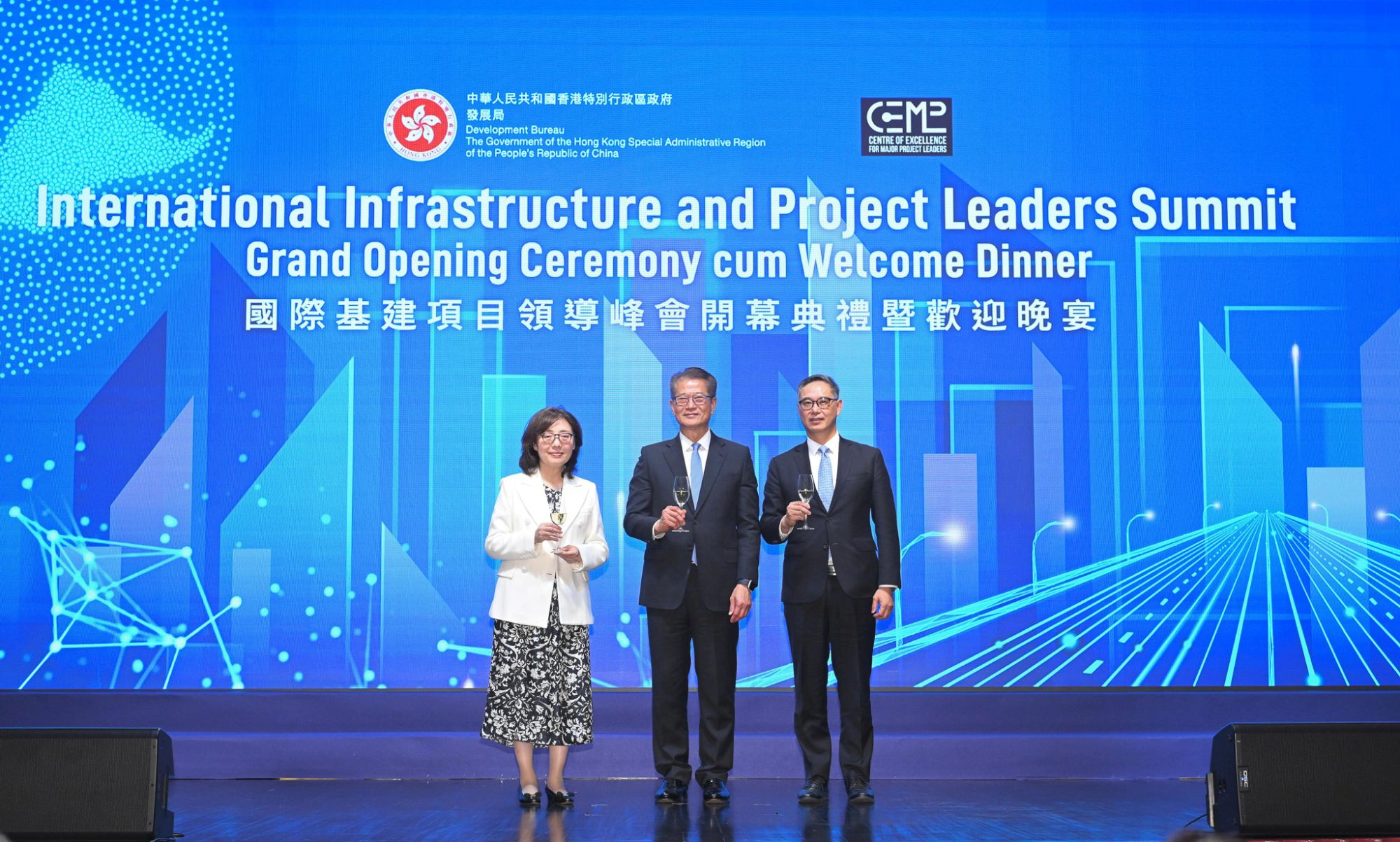 Mr Paul CHAN, Financial Secretary (centre), Ms Bernadette LINN, Secretary for Development (left), and Mr Ricky LAU, Permanent Secretary for Development (Works) (right) attends the Grand Opening Ceremony and Welcome Dinner of the summit.
