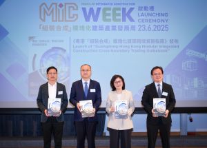 The Secretary for Development, Ms Bernadette LINN (second right); the Director-General of the DHURDGP, Mr ZHANG Yong (second left); the Director of the Division of the Construction Market Supervision of the DHURDGP, Mr ZHOU Zhuohao (first left) and the Head of Project Strategy and Governance Office of the DEVB, Mr LO Kwok-kuen, Joseph (first right), releasing the Guangdong-Hong Kong Modular Integrated Construction Cross-boundary Trading Guidebook (the Guidebook) at the launching ceremony.