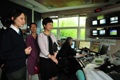 Mrs Lam (second right) visits the control room of Paris' tramway service.