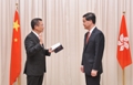 The new Secretary for Development, Mr Paul Chan Mo-po, takes the oath of office, witnessed by the Chief Executive, Mr C Y Leung, today (July 30).