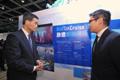 Mr Leung (left) tours the Hong Kong Pavilion.