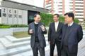 Mr Chan (centre) and Mr Lu (right) tour Zero Carbon Building after the meeting.