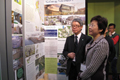 Mrs Lam and the Chairman of the Hong Kong Green Building Council (HKGBC), Mr Andrew Chan, view a panel at the exhibition booth set up by the HKGBC at the World Sustainable Building Conference 2011 in Helsinki, Finland on October 18 (Helsinki time). 