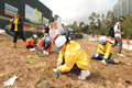 More than 50 students planted trees at a Community Planting Day under the Landslip Prevention and Mitigation Programme in Tung Chung, today (March 3). 2
