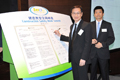Mr Wai (left) and Mr Lam (right) sign the Joint Declaration, which vows to ensure safety of workers. 