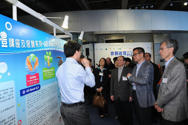 Mr Chan (second right), Dr Chan (first right) and Mr Ma (third right) visit the All About H2O special exhibition.