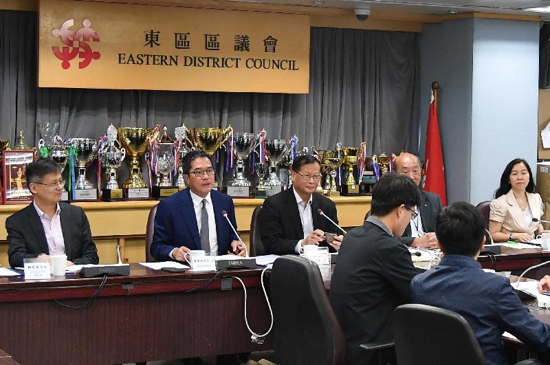 The Secretary for Development, Mr Michael Wong (second left), visited Eastern District today (May 3), where he met with members of the Eastern District Council to listen to their views and suggestions on the work of the Government and exchange views on residents' issues of concern. Looking on are the Chairman of Eastern District Council, Mr Wong Kin-pan (third left), and the District Officer (Eastern), Ms Anne Teng (right).