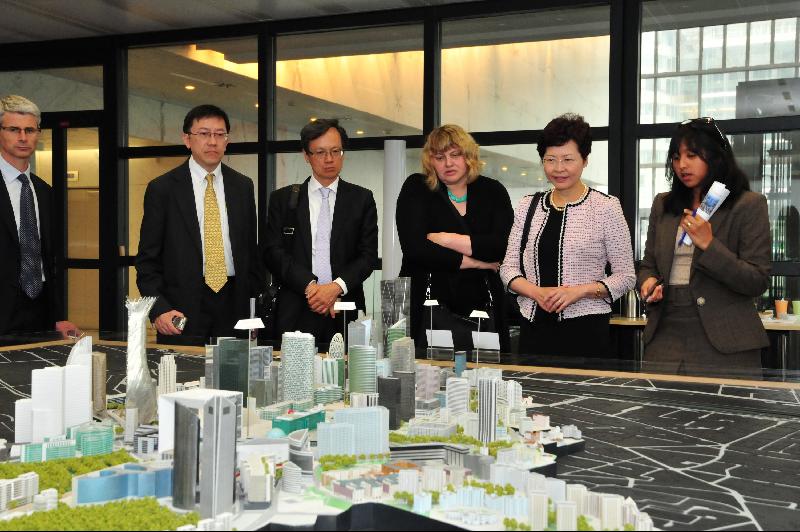 Mrs Lam (second right) is briefed on the latest development of the La Défense business district.